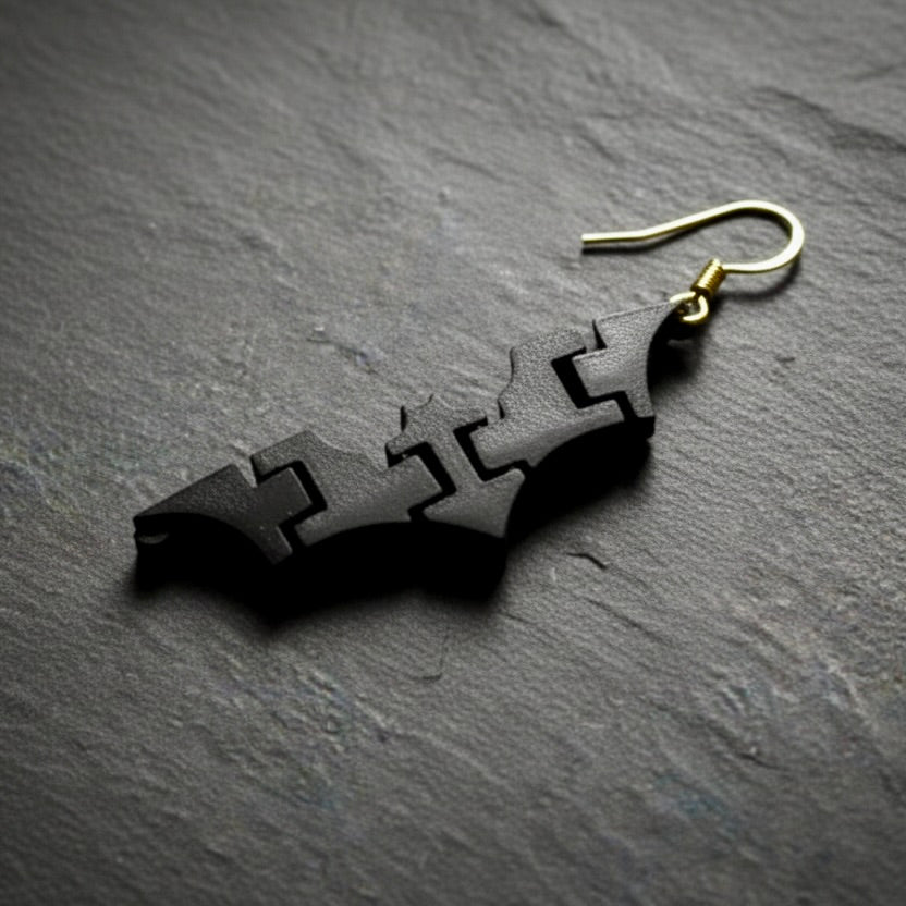 Single black 3D-printed batarang earring with an 18k gold-plated finding