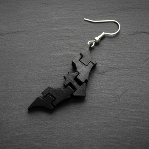 Single black 3D-printed batarang earring with a sterling silver finding